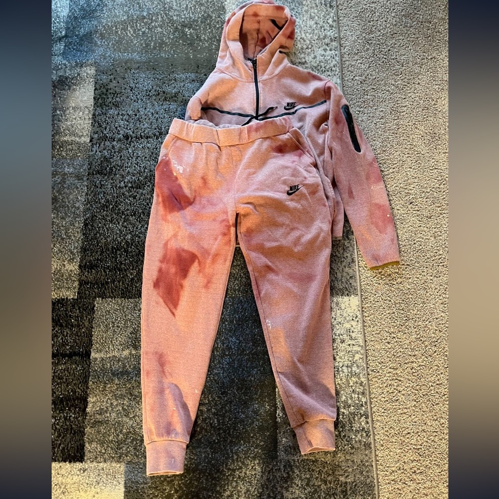 Pink red Nike tech suit